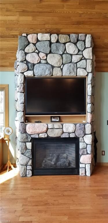 Stone gas fireplace with built in tv...tv stays wi