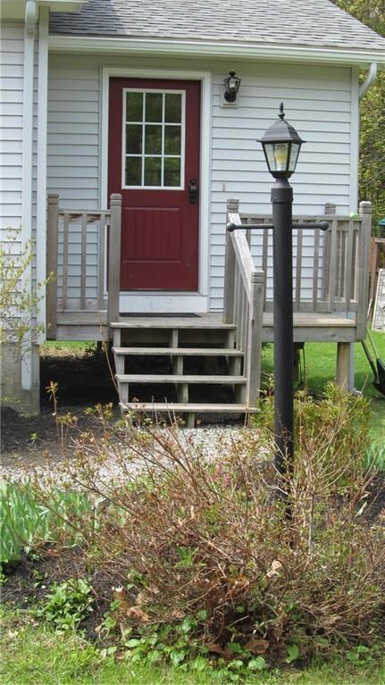 Mudroom entrance and more landscaping.