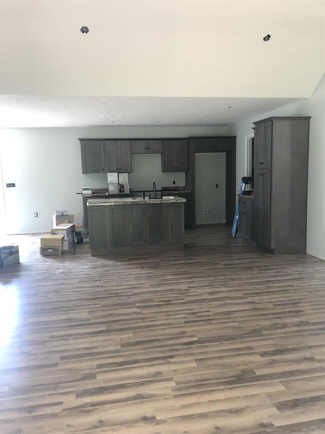 Kitchen is open to the living room and dining room. 