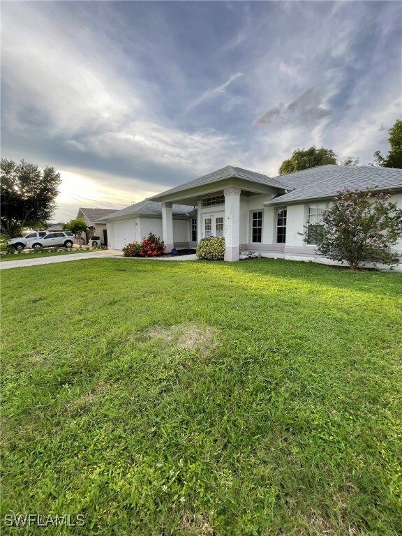 View of front of house with a front yard