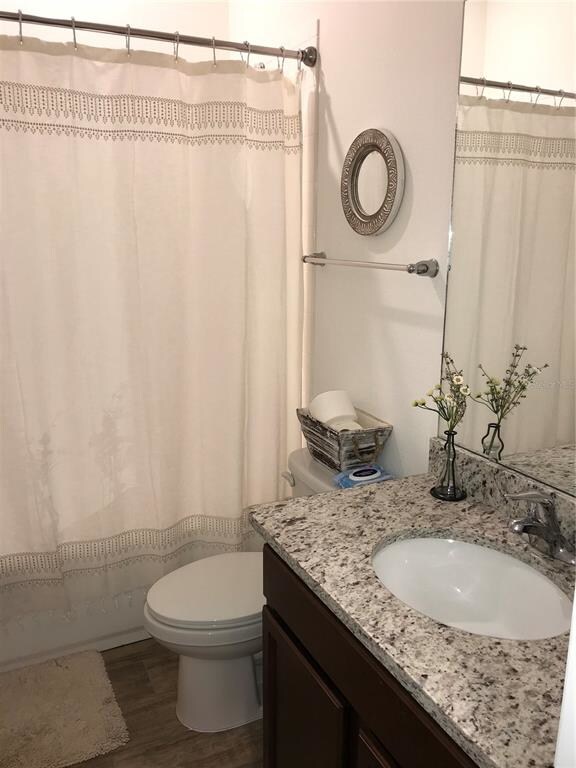 Bath that goes between the two bedrooms.  Granite 