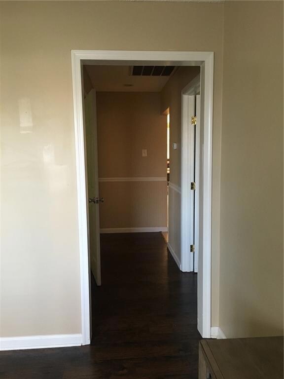 Hallway leads to 2 private bedrooms and bathroom