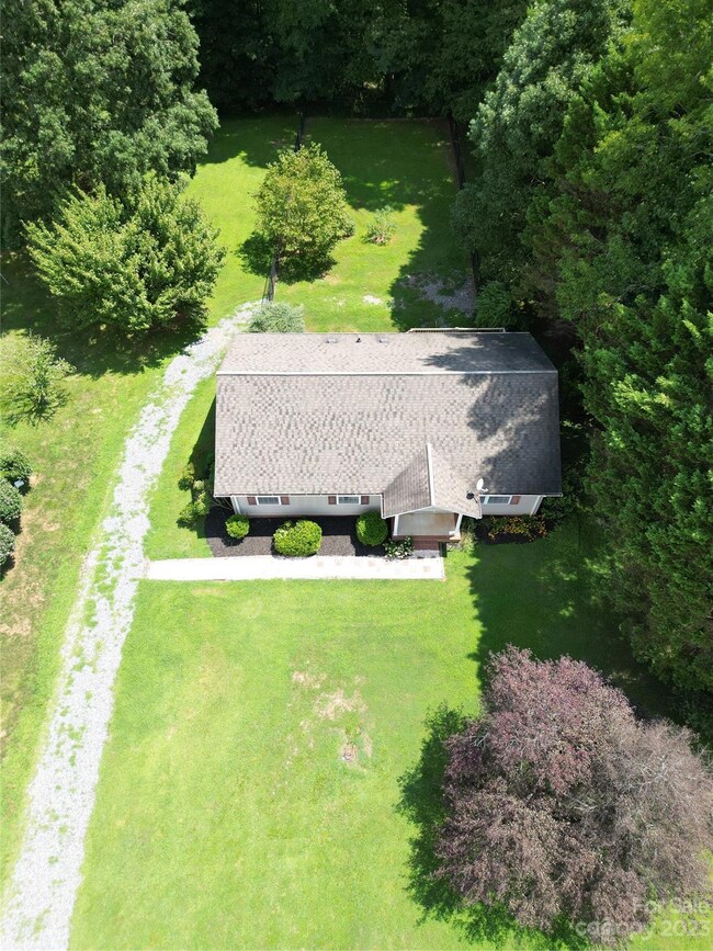 Over 1 acre lot that goes deep in woods to a creek!