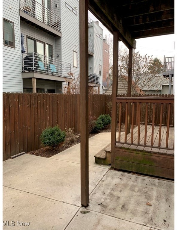 Fenced backyard featuring a patio