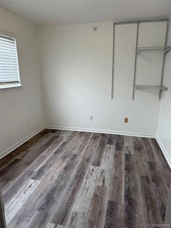 Unfurnished bedroom with wood finished floors