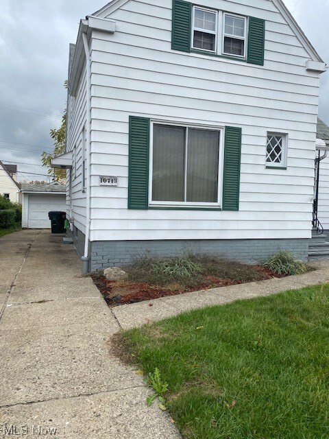 View of side of home with a garage
