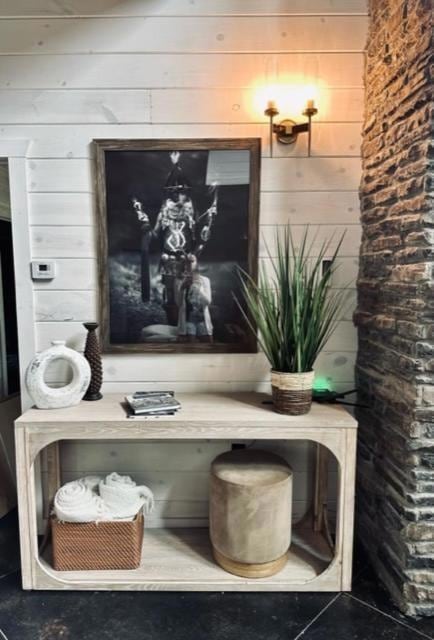 Room details featuring wood walls