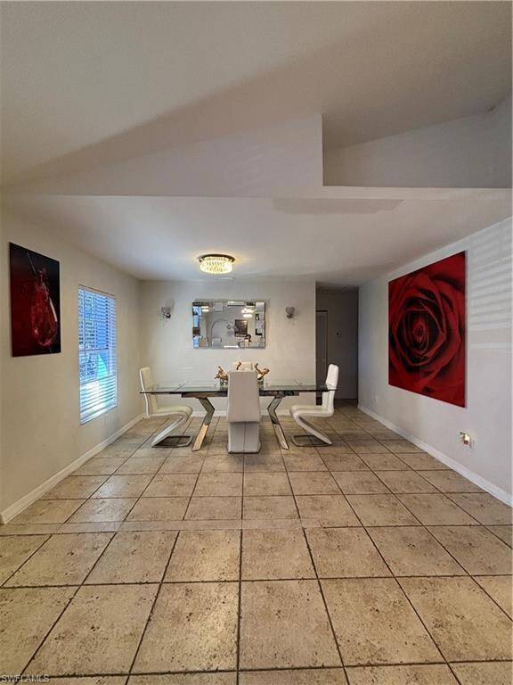 Unfurnished dining area with light tile patterned 