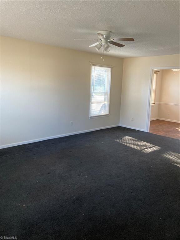 View from front door through to the eat in kitchen