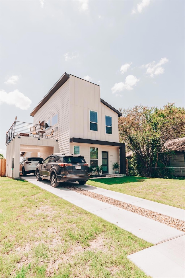 View of property exterior with a lawn, a garage, 