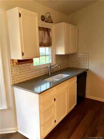 new solid surface counters and subway tiled backsp