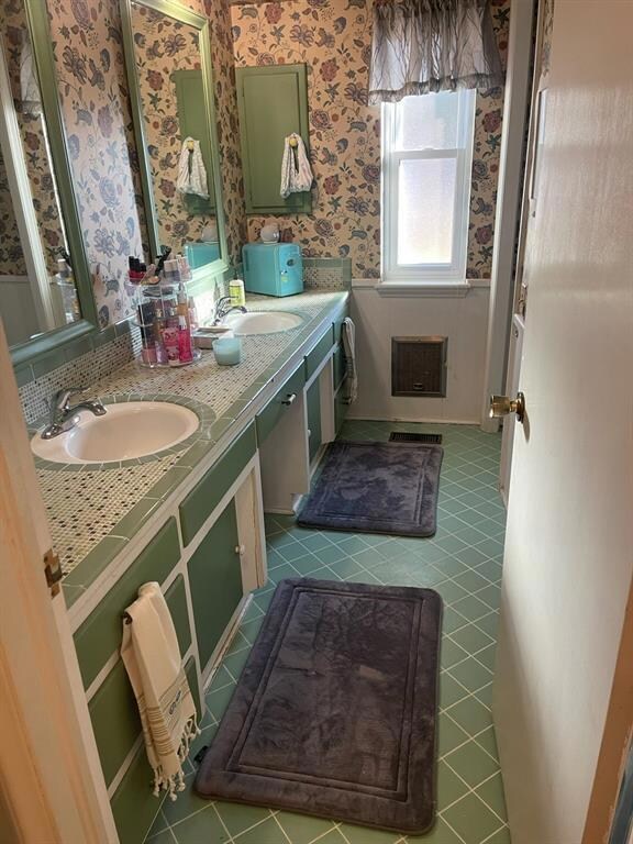 Bathroom with vanity and tile patterned floors
