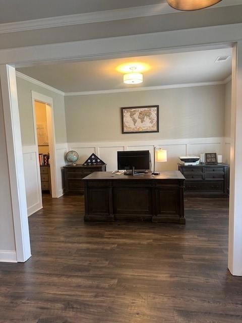 Office space with a wainscoted wall, dark wood-style floors, a decorative wall, and ornamental molding