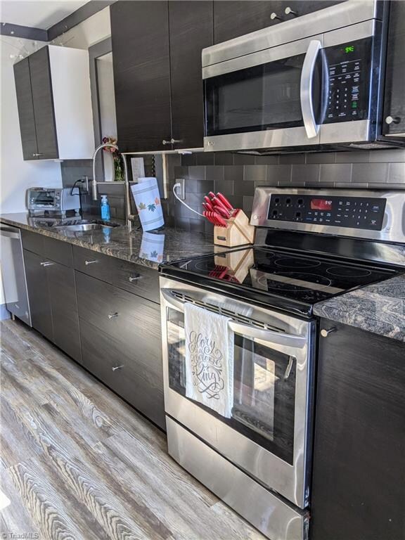 Renovated kitchen with beautiful granite countertops.