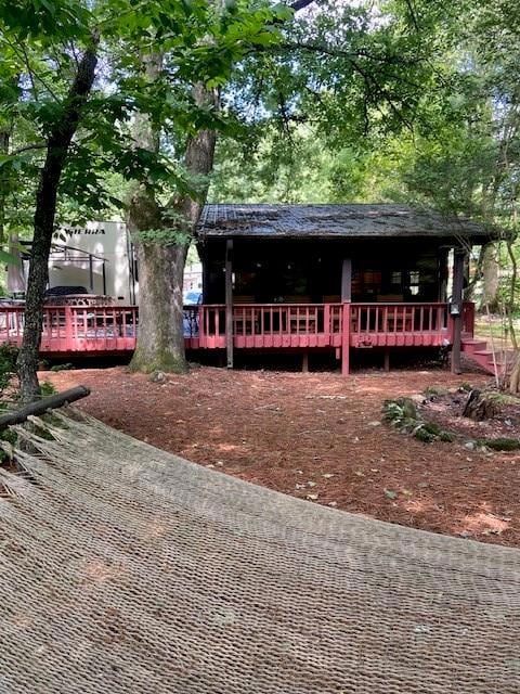 View of front of home featuring a wooden deck