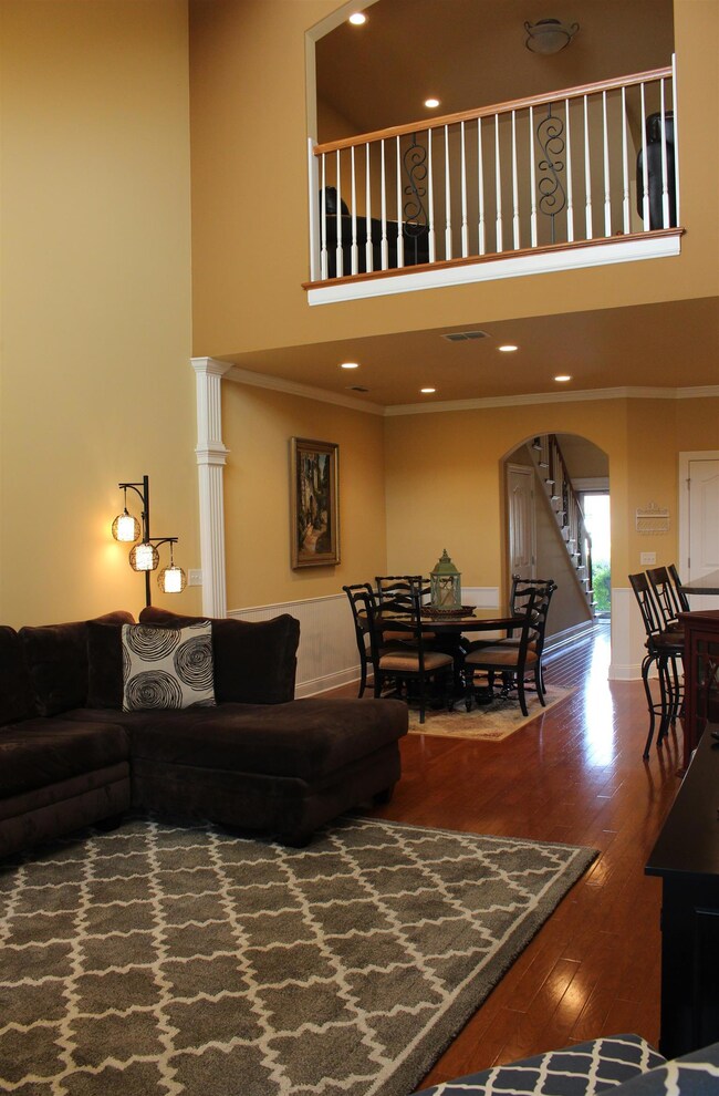 Popular open floor plan with arched doorways, and a lovely loft area that overlooks the family room.