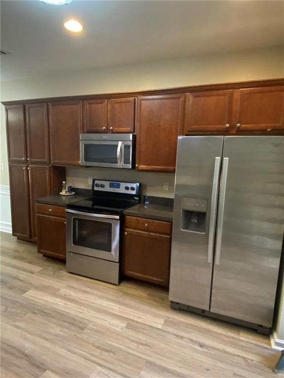 Kitchen featuring appliances with stainless steel 