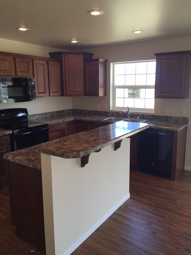 Kitchen. Photo of similar home.