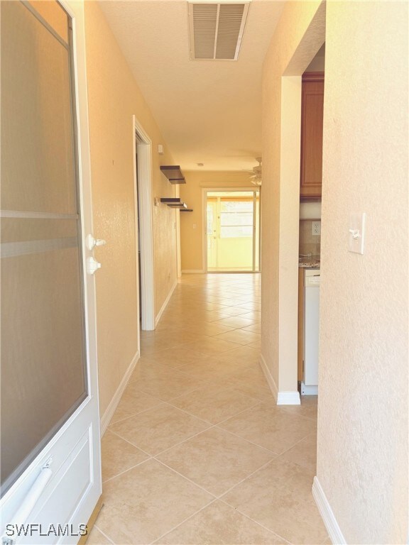 Entry Hall featuring light tile patterned floors