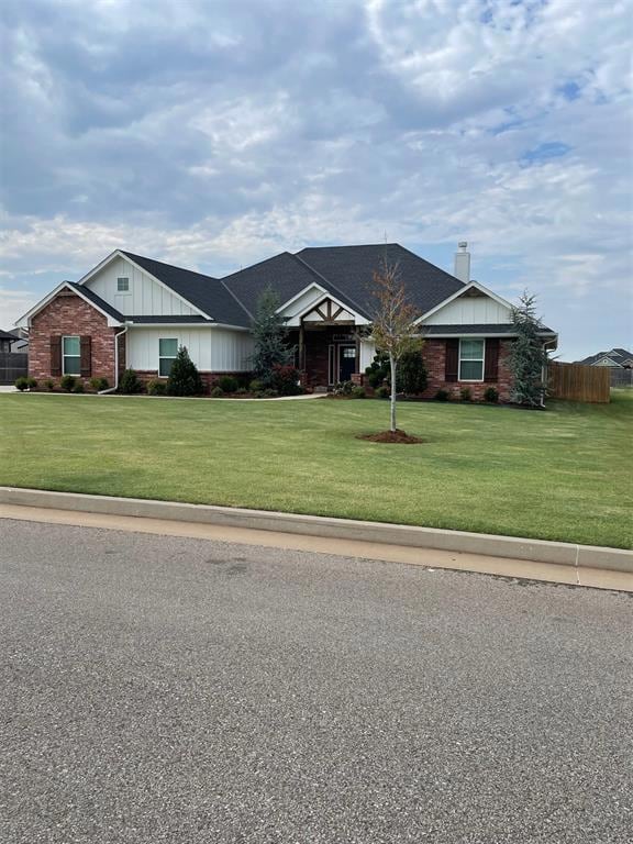 Single story home with a front yard
