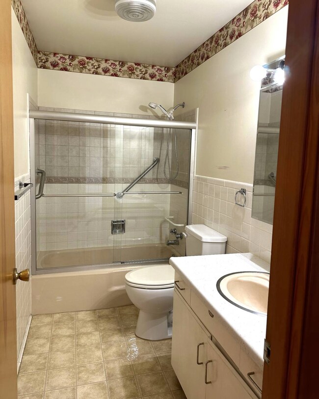 bath with glass enclosure