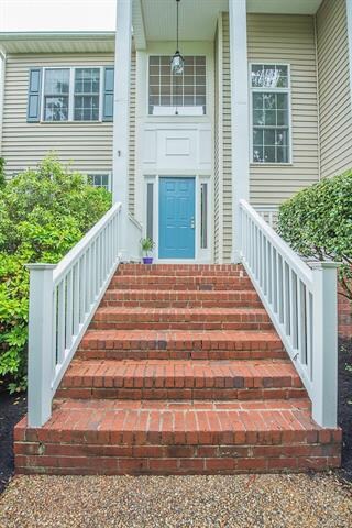 Ascend the stairs to your next home. The front por