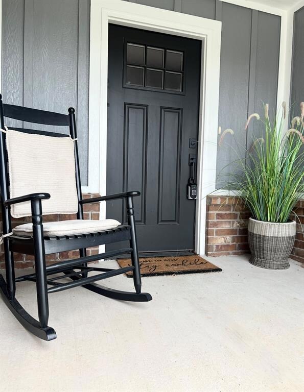 View of exterior entry featuring a porch