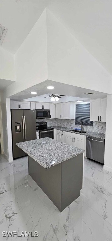 Kitchen featuring appliances with stainless steel