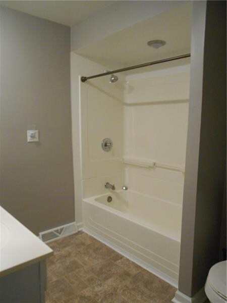 Tub/shower enclosure is immaculate.