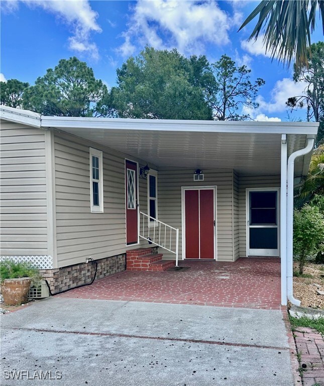 View of front of house with an attached carport, e