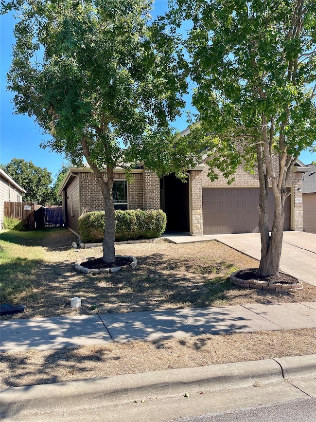 Mid-century modern home with concrete driveway, b