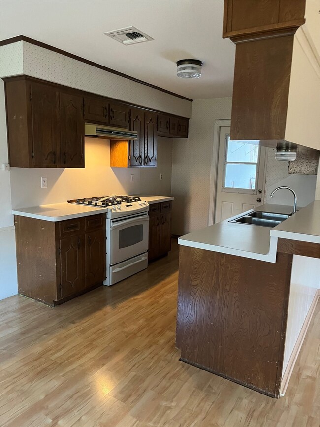 Cozy kitchen with laminate floors.
