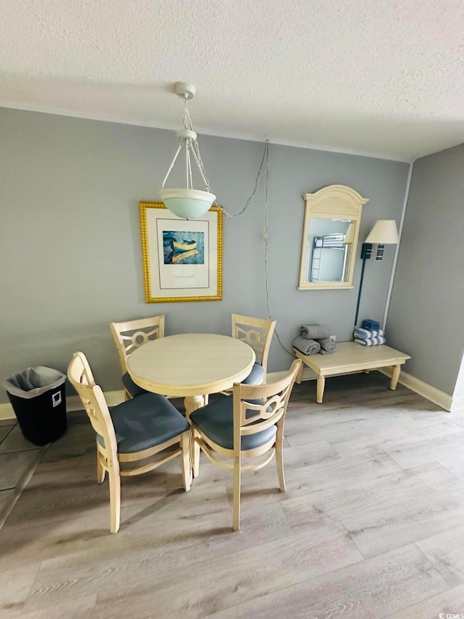 Dining area featuring light hardwood / wood-style 