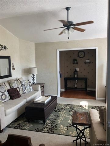 spacious living open from foyer and to dining room