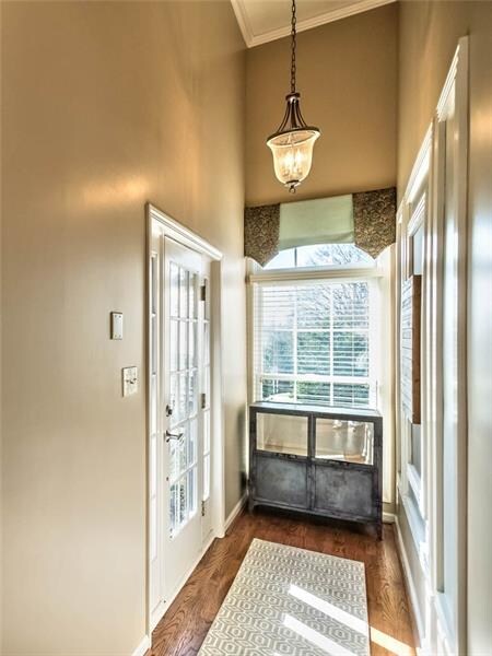 Covered Entry into a Hardwood Foyer