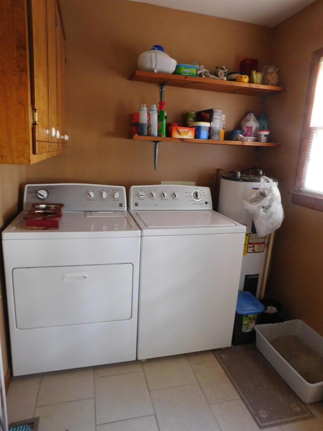 Large utility room with tile floors