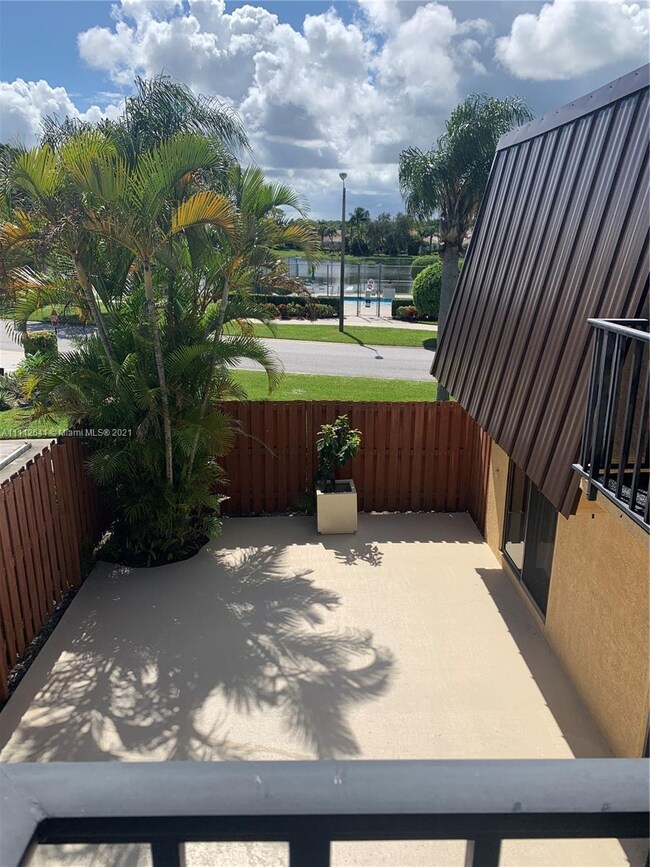 2ND Floor Guest Bedroom view of Courtyard and Comm