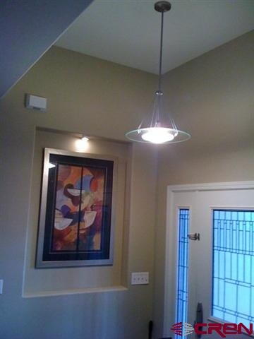 8 foot interior doors, brushed nickel hardware & vaulted entry.