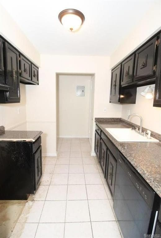 Kitchen with light tile patterned floors, black dishwasher, dark countertops, and dark cabinets