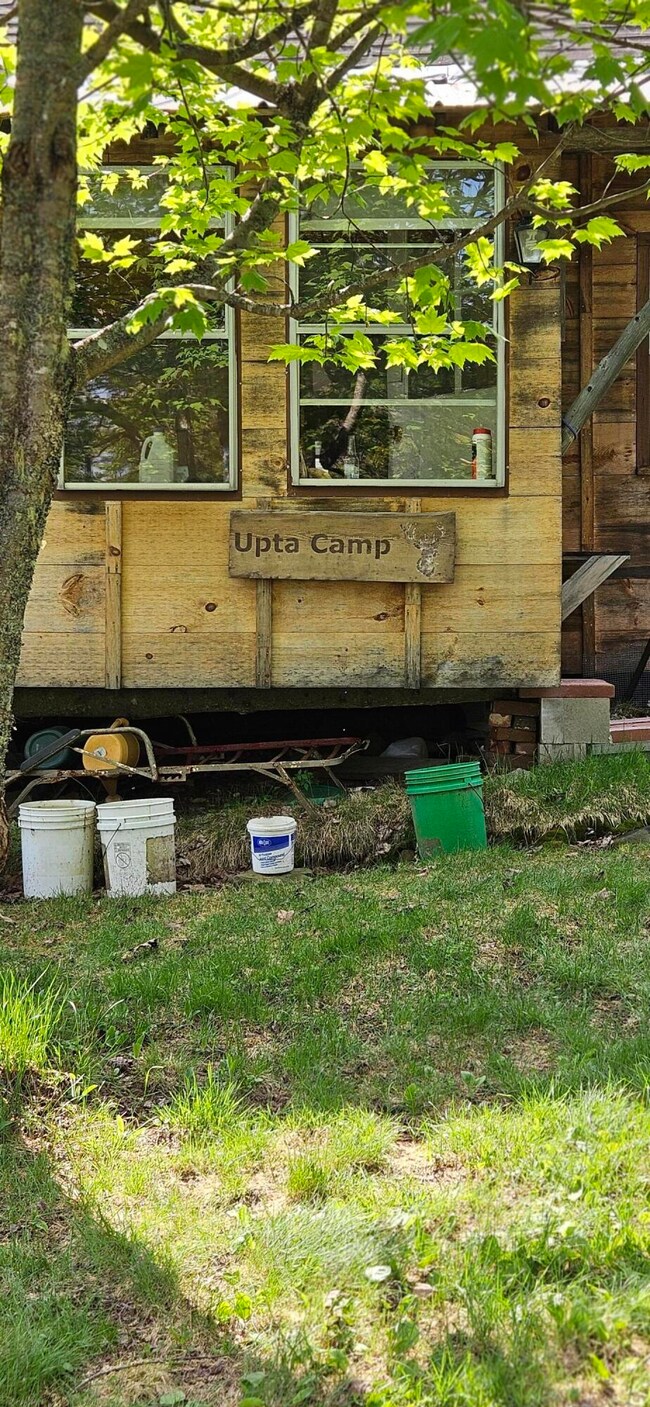 Upta Camp sign on porch