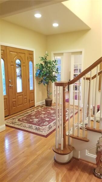 POCKET DOORS OFF OF THE FOYER LEAD TO PRIVATE DEN!