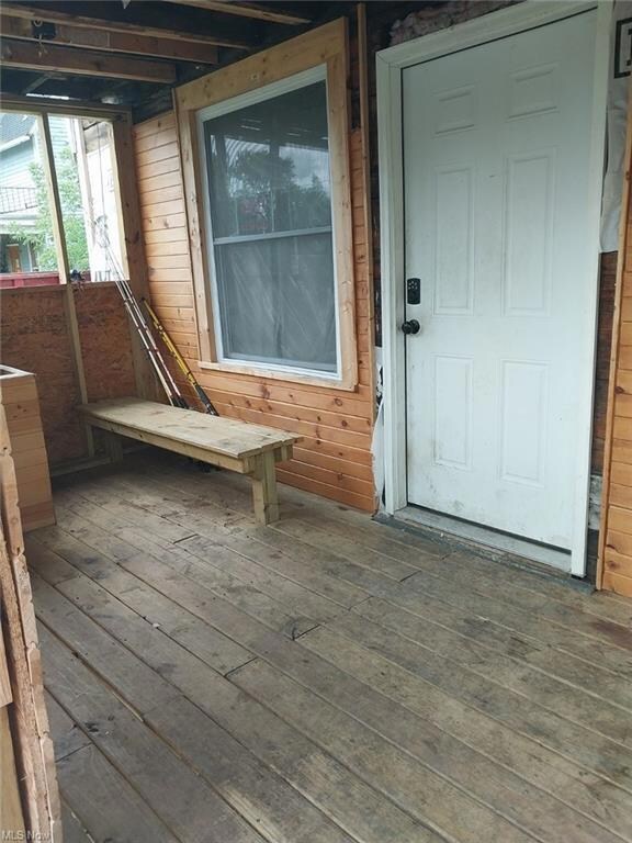Entrance to property featuring a deck