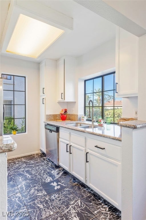Another kitchen window above the sink lets you enjoy views of the greenery while prepping meals or cleaning up, complemented by an upgraded faucet for added style and function