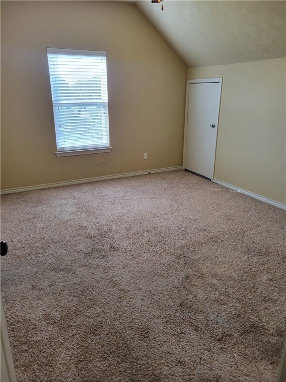 Additional living space featuring baseboards, ligh