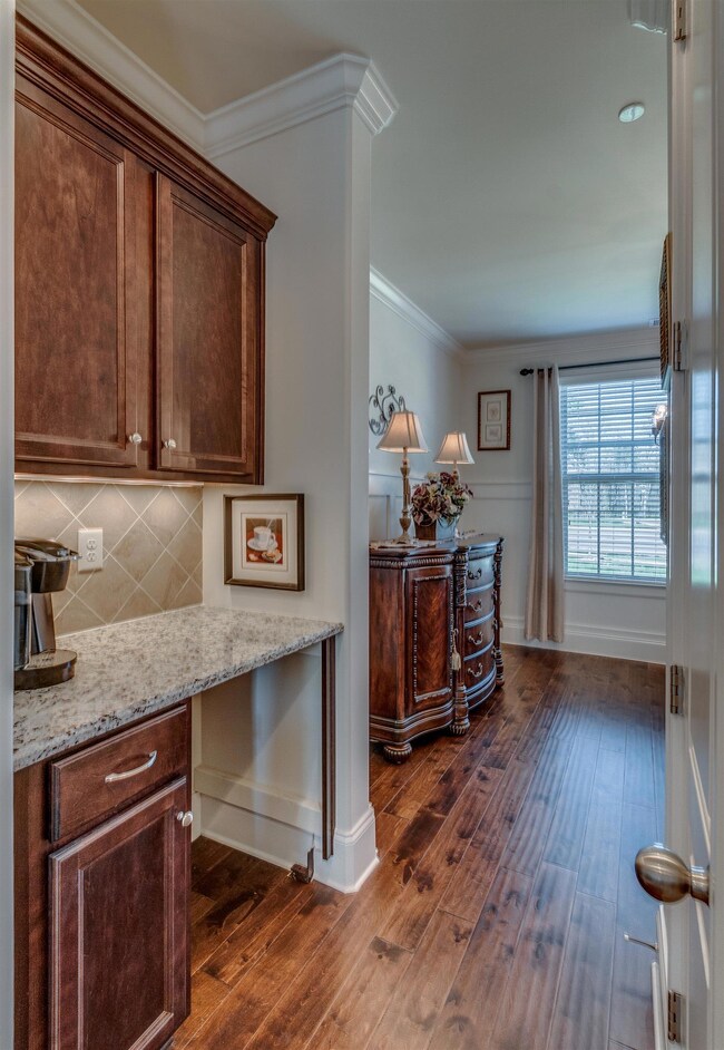 Butler's pantry and walk in pantry between formal dining and large kitchen.