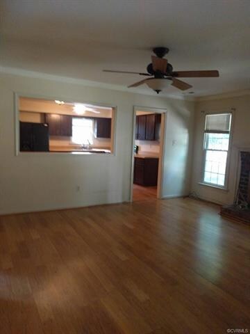 Living room looking into large kitchen