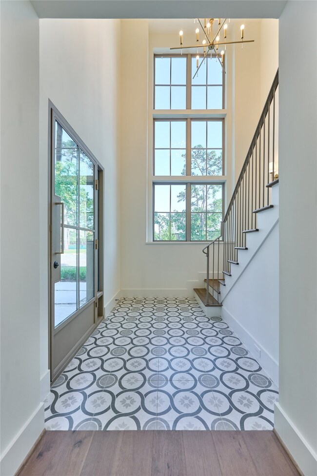 This entryway features a high ceiling with large w