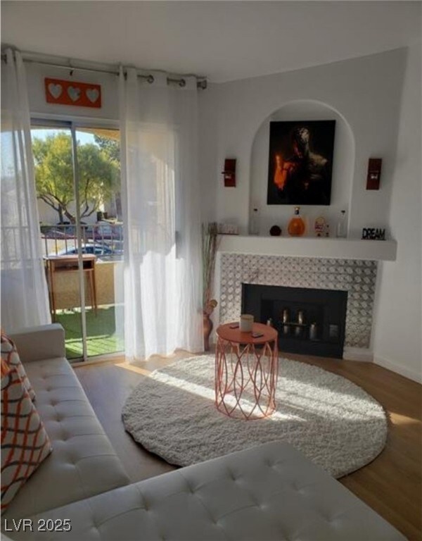 Living room featuring wood finished floors and a t