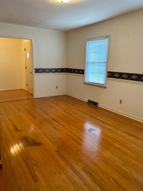 Formal living room with hardwood floors