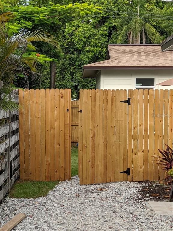 Access unit through gate on left side rear. Unit i